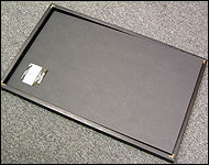 Picture of the foamcore being slid into the frame.