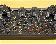 Picture of Ty's Black Templars arrayed on the foamcore.