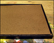 Picture showing the hardboard sliding into the frame.