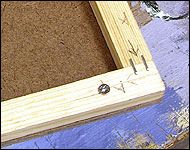 Picture of the inner frame screwed down to the hardboard.