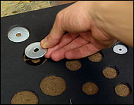 Picture showing how to drop the fender washers into the foamcoare slots.